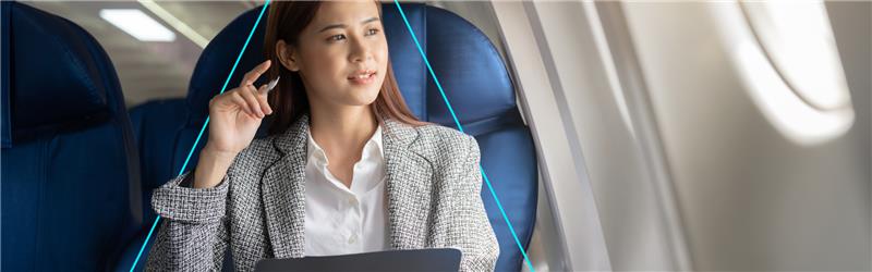 NDC 2025 it's here, a corporate woman in an airplane.